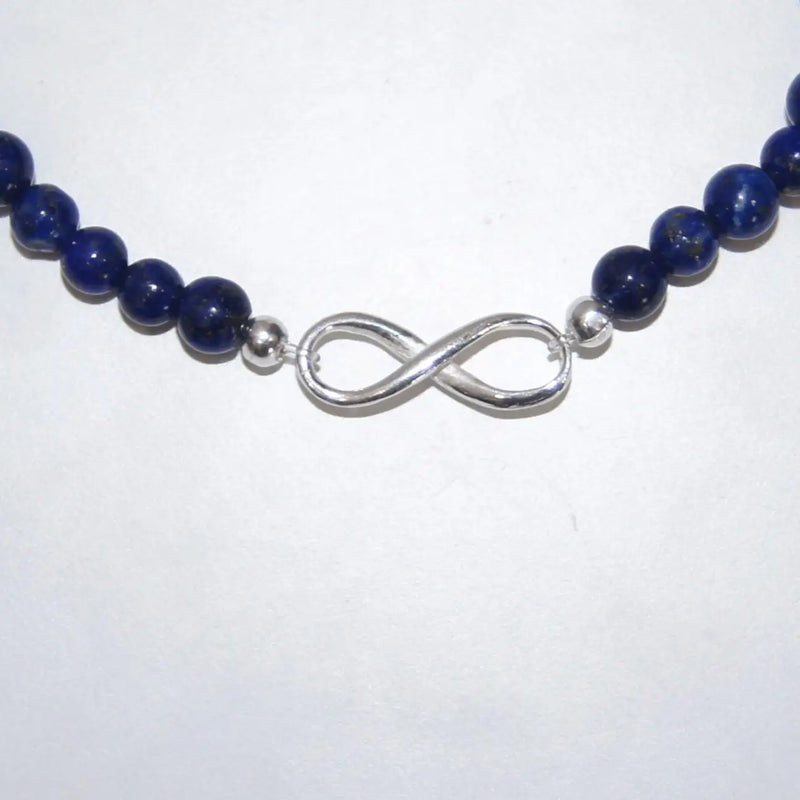 LEÑA Kunsthandwerk Armband aus Lapislazuli-Perlen (4 mm) und Silber (925) Endlosschleife