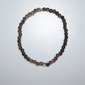 LEÑA Kunsthandwerk Rauchquarz-Perlenarmband (4 mm) auf Elastik-Faden, Größen 13–20 cm, Made in Austria