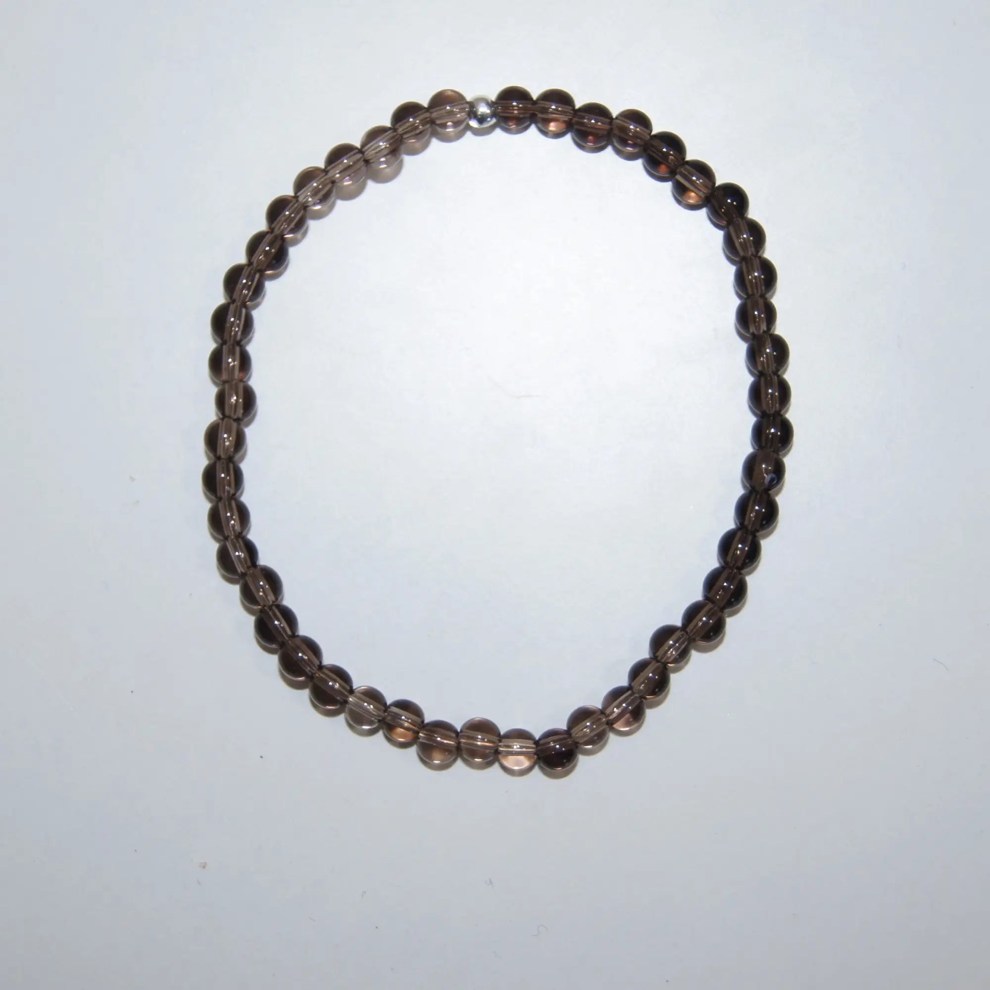 LEÑA Kunsthandwerk Rauchquarz-Perlenarmband (4 mm) auf Elastik-Faden, Größen 13–20 cm, Made in Austria